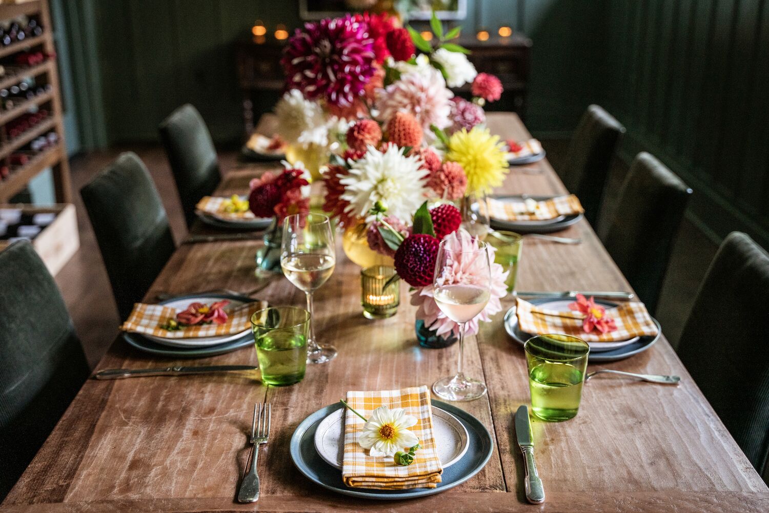 A rustic tablescape is set with colorful dahlias.